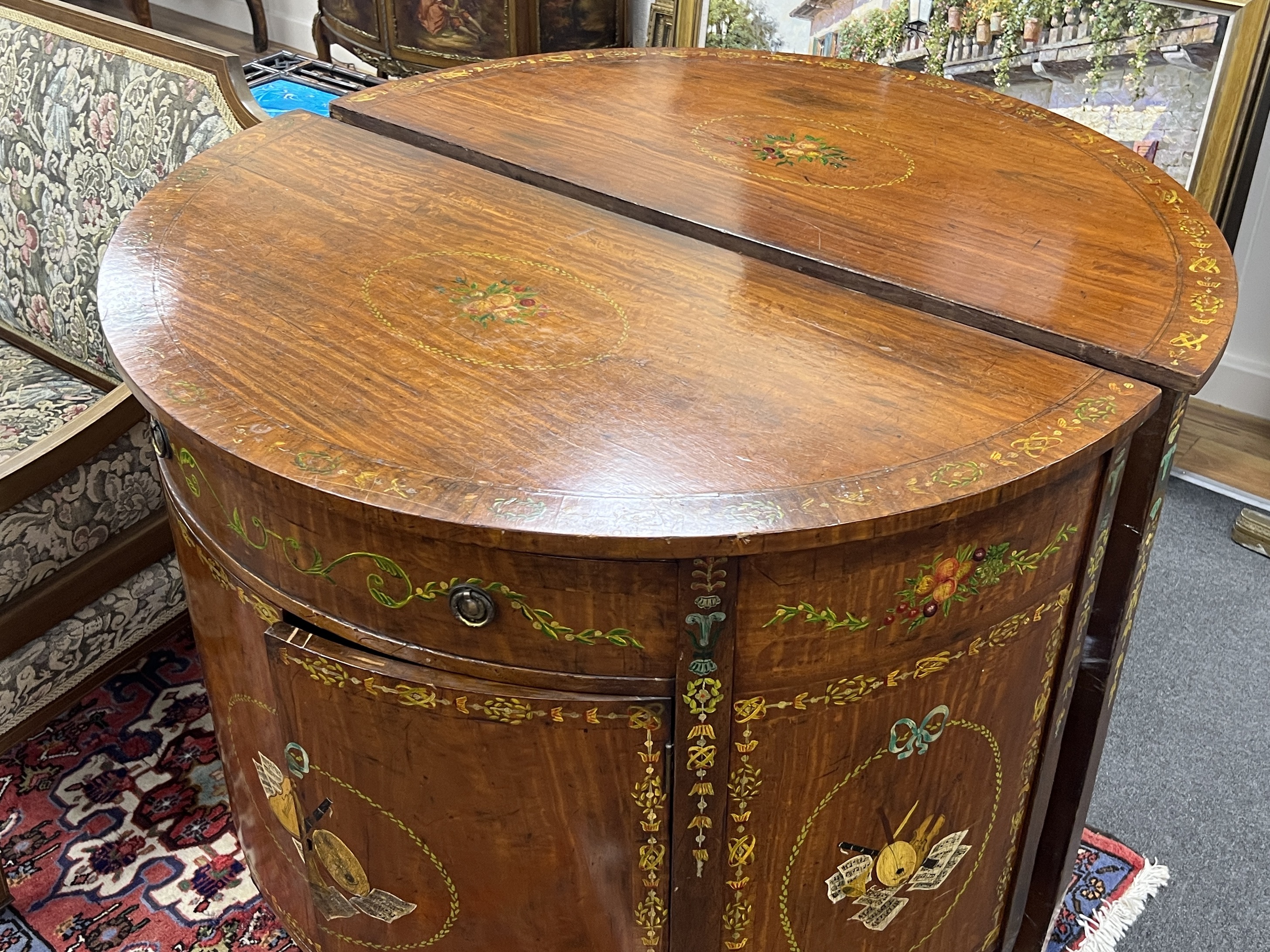 A pair of Sheraton revival painted D shaped commodes, width 107cm, depth 54cm, height 92cm